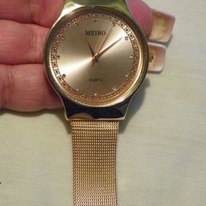 Rose Goldtone Ladies crystal watch stainless back